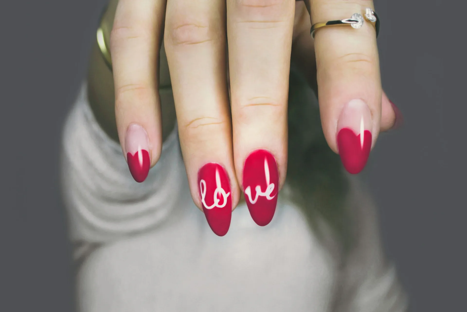 Close-up of a hand with a fresh pink manicure